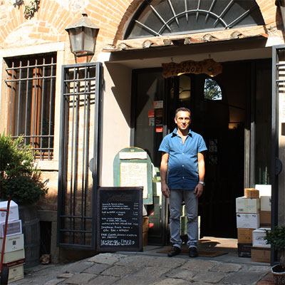 Francesco Tognoni in front of his Enoteca Tognoni in Bolgheri