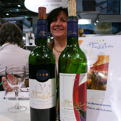 Maryse Roba, owner of Château Vieux Robin with two of her 2005s: the Cuvée Bois de Lunier and the Collection Bois de Lunier